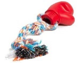 Farm Company rubber boxing glove with rope, 30cm, for pet training and exercise, shown in natural outdoor setting.