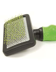 Farm Company soft slicker grooming brush with PVC tips for large pets, designed for gentle, effective coat grooming.